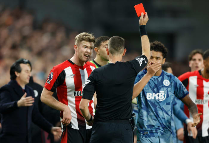 Referee David Coote pictured showing a red card to Boubacar Kamara (right) towards the end of Aston Villa's 2-1 win at Brentford in December 2023